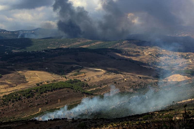 Heavy smoke from Israeli airstrikes rises from a suspected Hezbollah position in the southern Lebanese village of Mahmoudieh. Israeli warplanes carried out more than 50 strikes on several villages in one day after a deadly attack on the southern Beirut suburb that killed 31 people, including Hezbollah commanders from the elite al-Radwan Brigade. Marwan Naamani/dpa