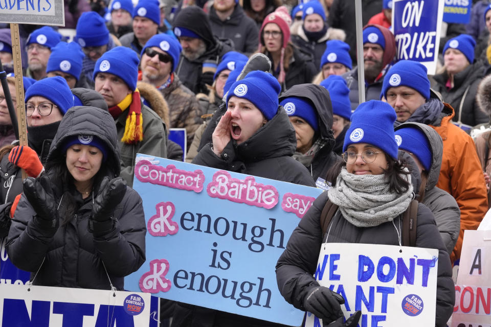 Striking Newton teachers and supporters display placards and chant during a rally, Tuesday, Jan. 30, 2024, outside Newton City Hall, in Newton, Mass. Contract negotiations between the Newton Teachers Association and the city's School Committee continued Tuesday. (AP Photo/Steven Senne)