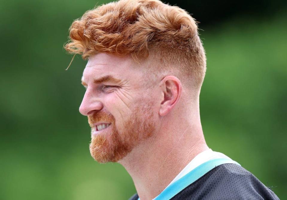 Carolina Panthers quarterback Andy Dalton walks to the team’s OTA practice on Tuesday, June 4, 2024.