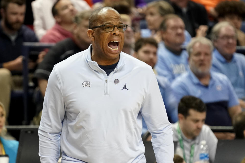 FILE - North Carolina head coach Hubert Davis shouts to his team during the first half of an NCAA college basketball game against Virginia at the Atlantic Coast Conference Tournament in Greensboro, N.C., March 9, 2023. The North Carolina Tar Heels are ranked No. 19 in the preseason AP Top 25. (AP Photo/Chuck Burton, File)