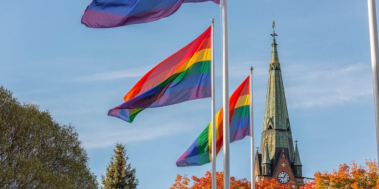 rainbow flag in front of church