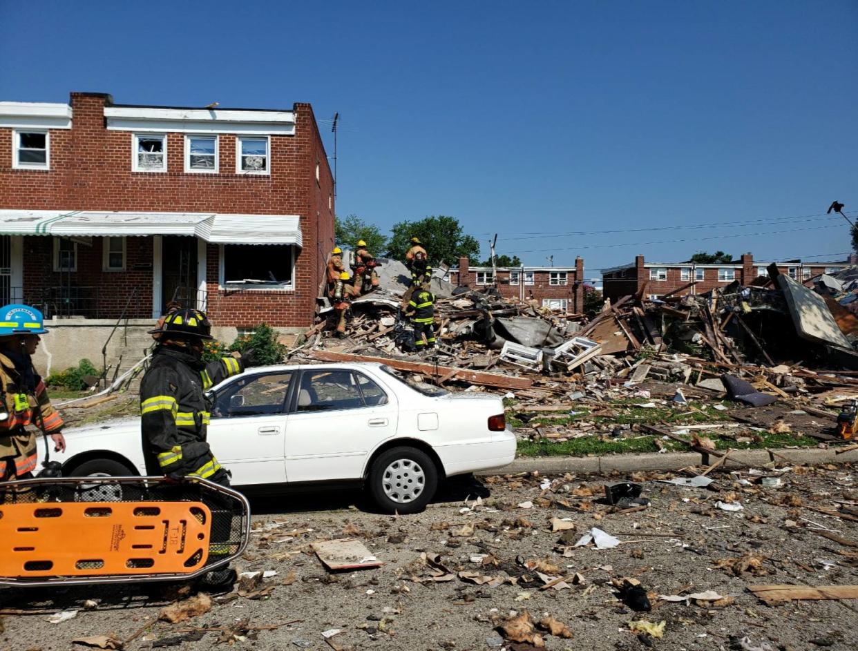 Firefighters respond to a major gas explosion that destroyed three homes in a Baltimore neighbourhood: Baltimore County Fire Department