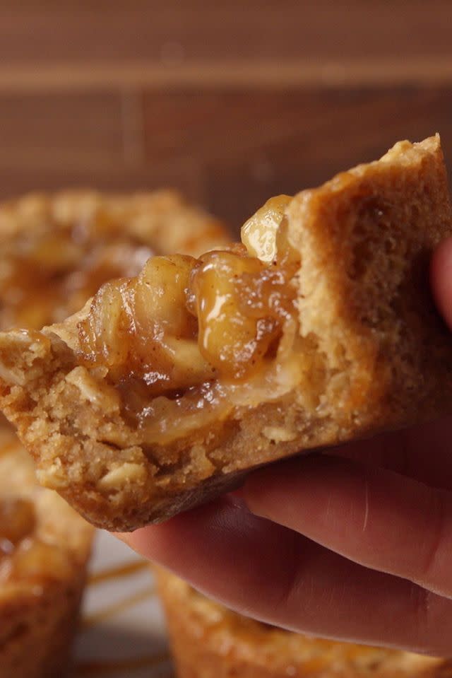 <p>Filled with gooey apple center, they're just like mini apple pies!</p><p>Get the <a href="https://www.goodhousekeeping.com/food-recipes/dessert/a40715/apple-crisp-cookie-cups-video/" rel="nofollow noopener" target="_blank" data-ylk="slk:Oatmeal Cookie Cups recipe;elm:context_link;itc:0;sec:content-canvas" class="link "><strong>Oatmeal Cookie Cups recipe</strong></a>.</p>
