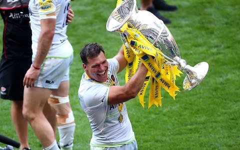 Schalk Brits of Saracens celebrates with the Aviva Premiership Trophy following his last game before retirement and his sides victory in the Aviva Premiership Final - Credit: Jordan Mansfield/Getty Images
