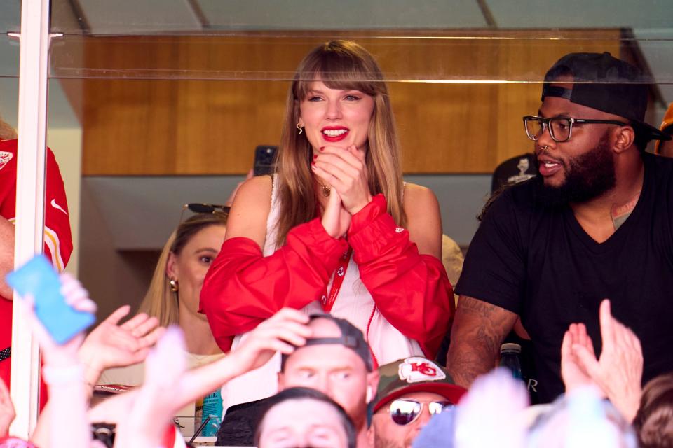 Taylor Swift cheers from a suite as the Kansas City Chiefs play the Chicago Bears at GEHA Field at Arrowhead Stadium