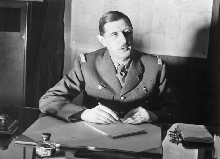 <span class="caption">Charles de Gaulle: Not really a party animal.</span> <span class="attribution"><a class="link " href="https://commons.wikimedia.org/wiki/File%3ACommander_of_Free_French_Forces_General_Charles_de_Gaulle_seated_at_his_desk_in_London_during_the_Second_World_War._D1973.jpg" rel="nofollow noopener" target="_blank" data-ylk="slk:Ministry of Information Photo Division/Wikimedia Commons;elm:context_link;itc:0;sec:content-canvas">Ministry of Information Photo Division/Wikimedia Commons</a></span>