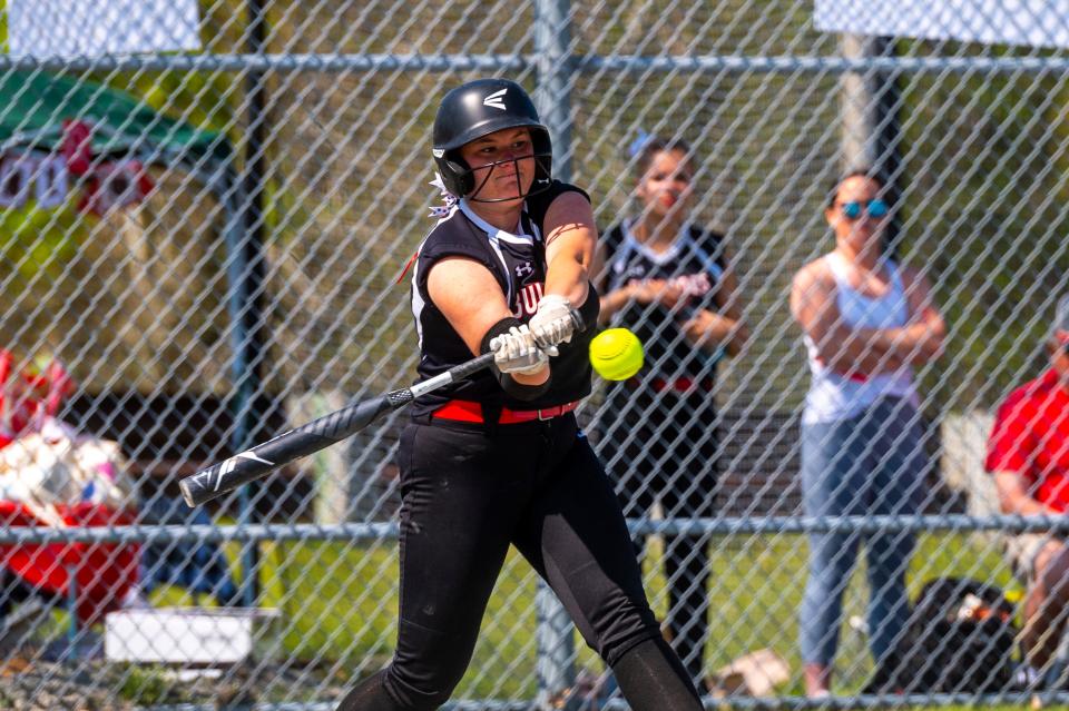 Old Rochester's Tavish Nunes hits a sacrifice fly to right field to drive in the run for the Bulldogs.