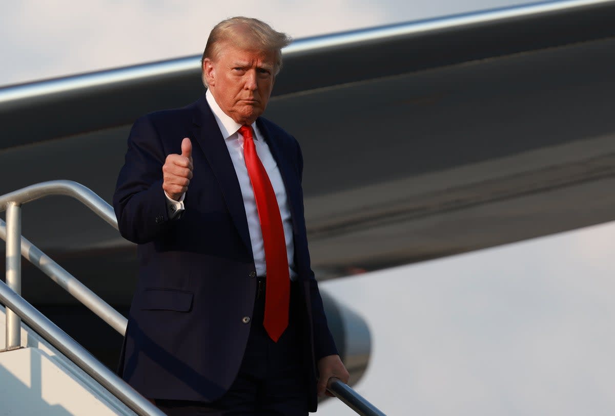 Donald Trump arrives in Atlanta for to be booked on election interference charges on 24 August (Getty Images)
