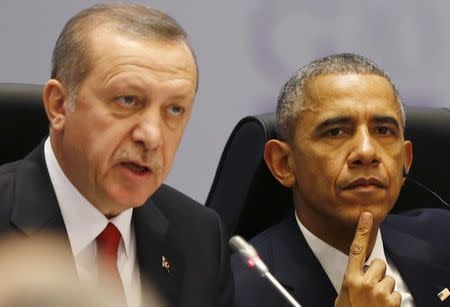 Turkey's President Tayyip Erdogan and U.S. President Barack Obama attend a working session at the Group of 20 (G20) summit in the Mediterranean resort city of Antalya, Turkey, November 15, 2015. REUTERS/Murad Sezer