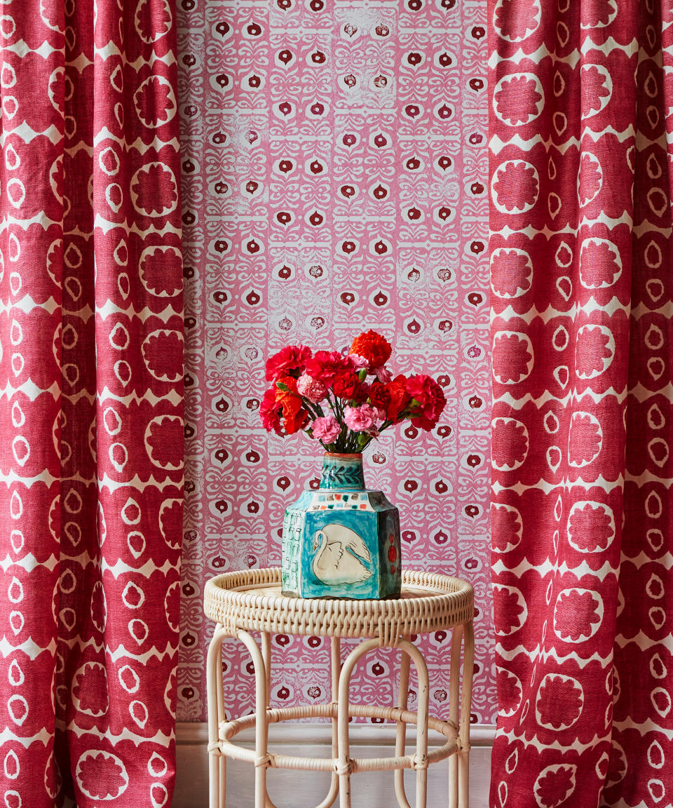 Choose a bold layered look with curtains and wallpaper