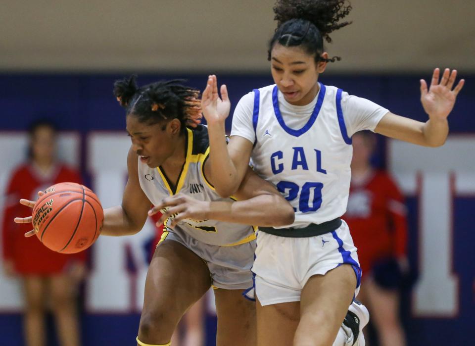 Central's Destiny Jones drives up the court as Christian Academy of Louisville's Ella Daniels pressures at the Seventh District Kentucky high school girls quarterfinals Monday night at Christian Academy of Louisville. Feb. 27, 2023