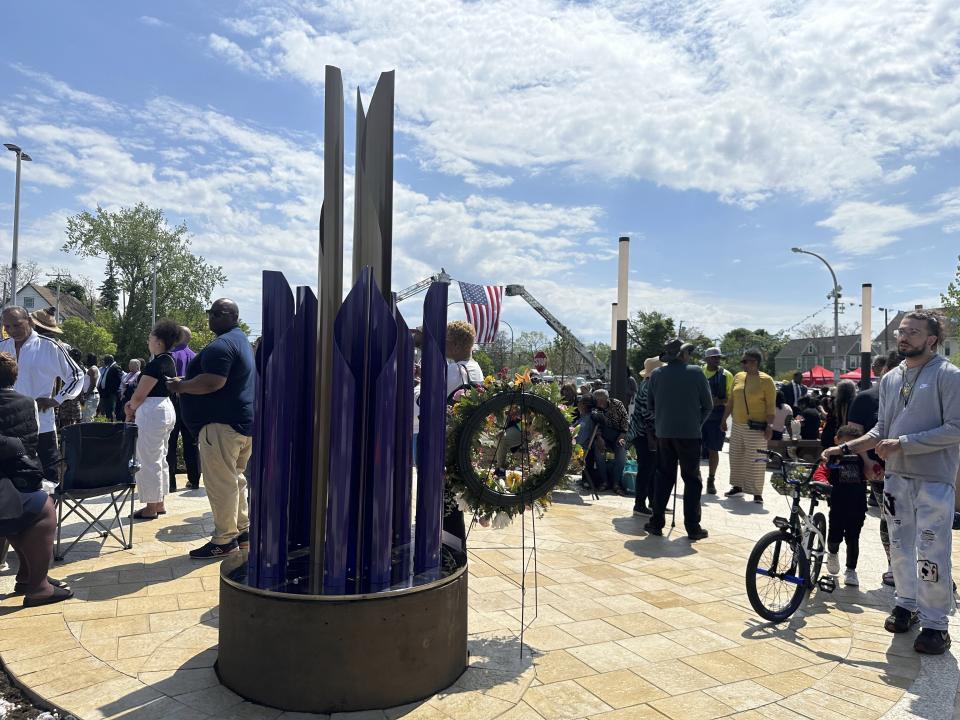 A sculpture entitled Unity was unveiled as the city marked the second anniversary of a racist mass shooting that killed 10 shoppers and employees at a Tops supermarket on Tuesday, May 14, 2024, in Buffalo, N.Y. The sculpture is part of the newly constructed 5/14 Tops Honor Space in front of the store. (AP Photo/Carolyn Thompson)