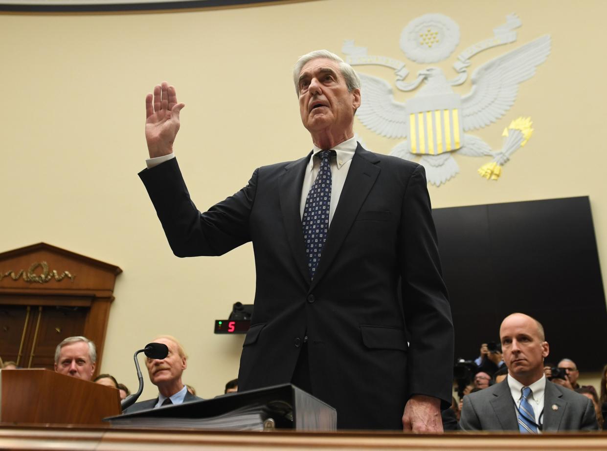 Former Special Prosecutor Robert Mueller is sworn in for his testimony before Congress on July 24, 2019, in Washington, DC. - Mueller is expected to testify about his two-year report on his investigation of Russian meddling in the 2016 elections.