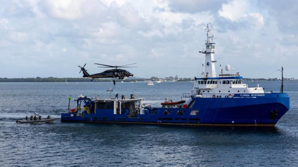 A U.S. Customs and Border Protection helicopter hovers aboard a vessel as a rescue team boards to recover sex trafficking victims during a South Florida Public Safety Regional Assets in Action Demonstration showcasing an active threat response incident in Biscayne Bay as part of the annual 2024 National Homeland Security Conference at PortMiami, Terminal J on Wednesday, July 24, 2024, in Miami, Fla.