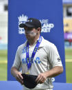 New Zealand captain Tom Latham waits to receive the winners trophy after their win in the second cricket test match against England at Edgbaston in Birmingham, England, Sunday, June 13, 2021. New Zealand won the series 1-0. (AP Photo/Rui Vieira)