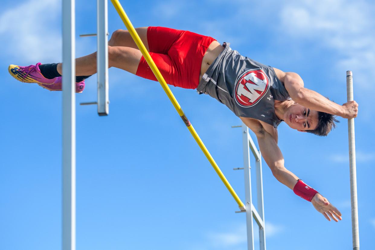 Morton's Calvin Leman clears the bar during the pole vaulting event Tuesday, May 7, 2024 at Carper Field in Morton. Leman finished second in the event, part of the 2024 Mid-Illini Championshp track and field meet.