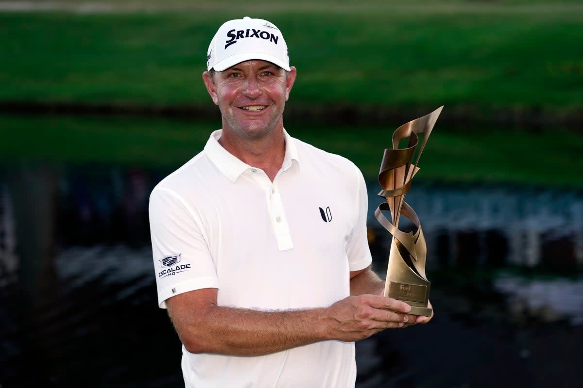 Lucas Glover holds the trophy after winning the St Jude Championship golf tournament (AP)