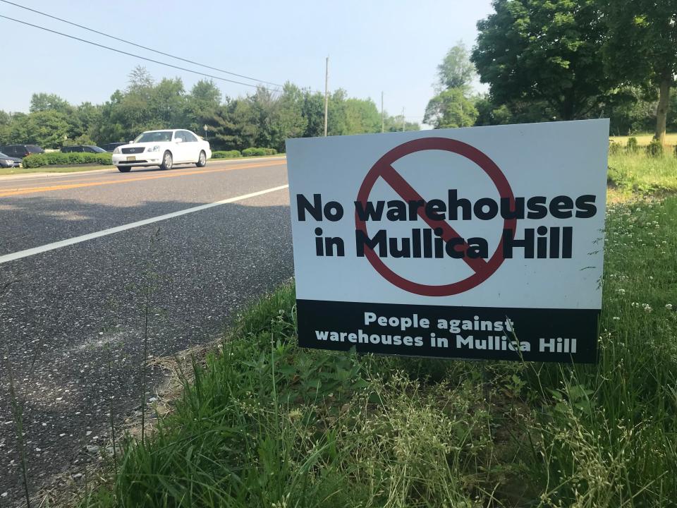 A major warehouse development project is focused on lands on either side of the Harrison and Woolwich township boundary lines, an area off Route 322 and near the New Jersey Turnpike. This sign along Tomlin Station Road, near Route 322, represents pushback from Harrison residents. Two lawsuits were filed in 2023 in state court by Harrison residents seeking to block such development. PHOTO: May 22, 2023