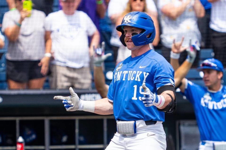 Kentucky center fielder Nolan McCarthy (19) celebrates after a two-run home run against N.C. State during the fourth inning Saturday at Charles Schwab Field in Omaha, Nebraska.