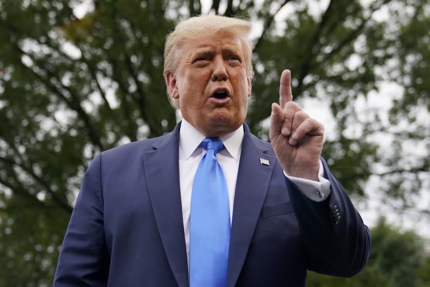 President Donald Trump speaks to members of the press on the South Lawn of the White House in Washington, Thursday, Sept. 24, 2020, before boarding Marine One for a short trip to Andrews Air Force Base, Md. Trump is traveling to North Carolina and Florida. (AP Photo/Patrick Semansky)