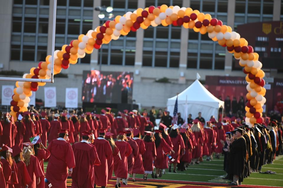 Students earning degrees at Pasadena City College participate in the graduation ceremony on June 14, 2019, in Pasadena, California. (Photo by Robyn Beck / AFP) 
