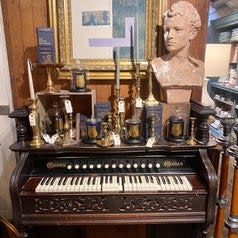 a piano with a statue on top