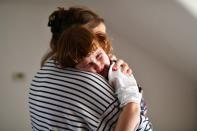 Maria, 31, holds her daughter Elena, who is two years and seven-months old, at their home in London, Britain, February 17, 2019. REUTERS/Alecsandra Dragoi