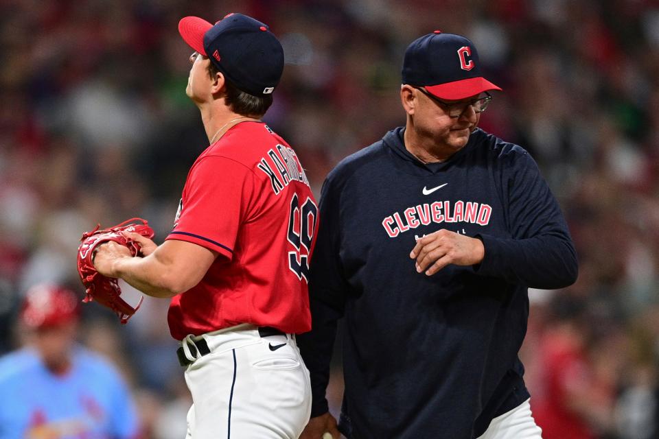 Cleveland Guardians relief pitcher James Karinchak, left, is removed from a baseball game by manager Terry Francona during the seventh inning against the St. Louis Cardinals, Saturday, May 27, 2023, in Cleveland. (AP Photo/David Dermer)