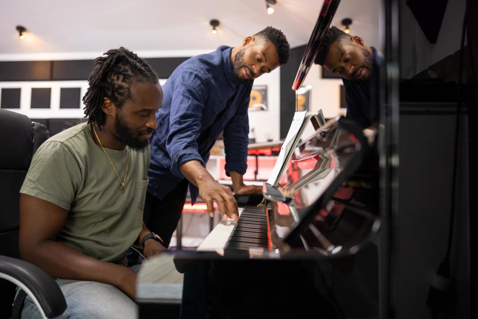 Grammy-winning producer DJ Dahi (left) and composer Kris Bowers work on crafting an American national anthem for modern times in the Hulu documentary "Anthem."