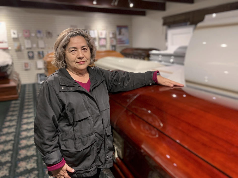 Magda Maldonado, owner of Continental Funeral Home in Los Angeles, poses in her mortuary on Dec. 30, 2020. Southern California funeral homes are turning away bereaved families because they're running out of space for all the bodies piling up during an unrelenting coronavirus surge that has sent COVID-19 death rates to new highs. "I've been in the funeral industry for 40 years and never in my life did I think that this could happen, that I'd have to tell a family 'no, we can't take your family member,'" said Maldonado. (Magda Maldonado via AP