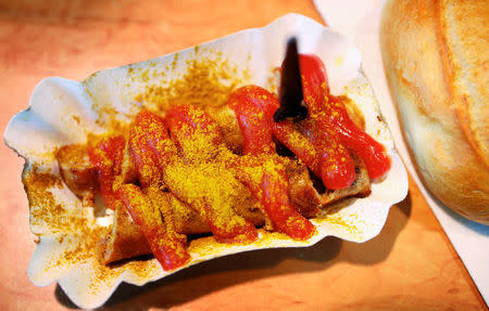 FILE PHOTO: A German Currywurst (curry sausage) is on display at a fast food stall at the open air market of Hanau, 30km south of Frankfurt, April 18, 2012. REUTERS/Kai Pfaffenbach/File Photo