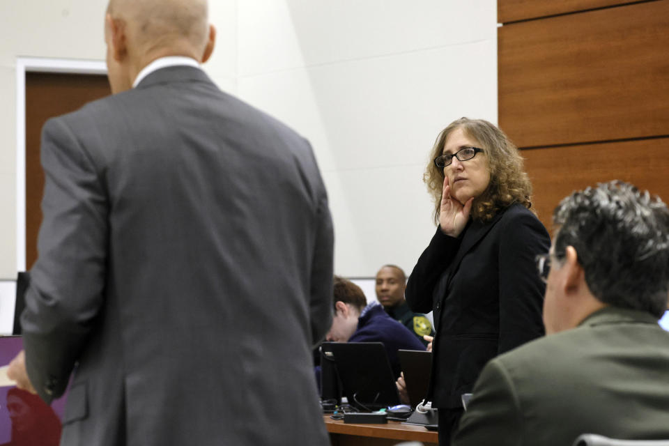 Assistant Public Defender Tamara Curtis looks towards Assistant State Attorney Mike Satz as he speaks during the penalty phase of the trial of Marjory Stoneman Douglas High School shooter Nikolas Cruz at the Broward County Courthouse in Fort Lauderdale, Fla., Thursday, Sept. 1, 2022. Cruz previously plead guilty to all 17 counts of premeditated murder and 17 counts of attempted murder in the 2018 shootings. (Amy Beth Bennett/South Florida Sun Sentinel via AP, Pool)
