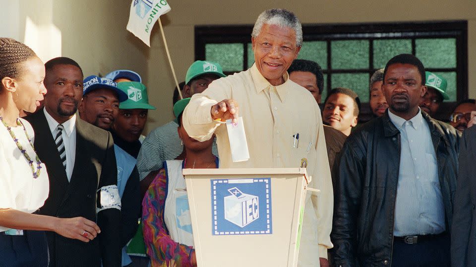 ANC leader Nelson Mandela smiles broadly on 27 April 1994 in Oshlange, a Black township near Durban, as he casts his historic vote during South Africa's first democratic and all-race general elections. - Walter Dhladhla/AFP/Getty Images