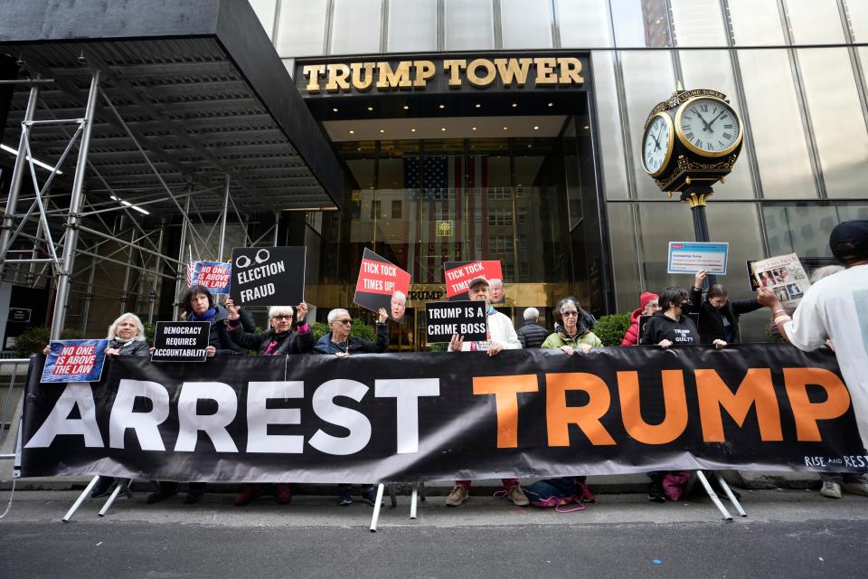 Protesters gather outside Trump Tower on Friday, March 31, 2023, in New York. Former President Donald Trump was indicted by a Manhattan grand jury, Thursday, a historic reckoning after years of investigations into his personal, political and business dealings and an abrupt jolt to his bid to retake the White House.(AP Photo/Bryan Woolston) ORG XMIT: NYBW107