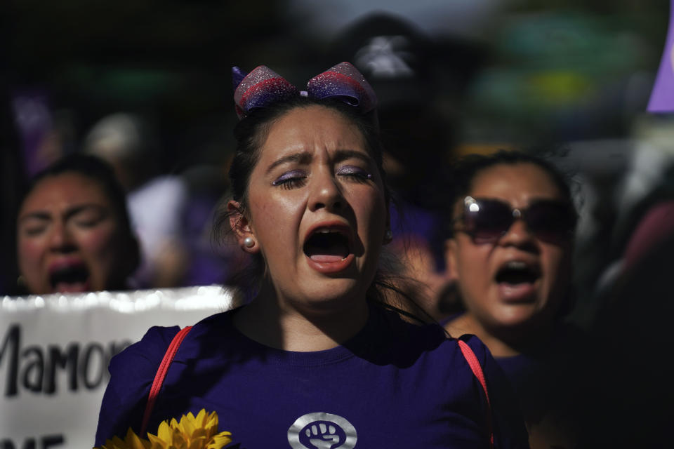 Feminist groups march to protest the murder of Ariadna Lopez, in Mexico City, Monday, Nov. 7, 2022. Prosecutors said Sunday an autopsy on Lopez who was found dead in the neighboring state of Morelos, showed she was killed by blunt force trauma. That contradicts a Morelos state forensic exam that suggested the woman choked on her own vomit as a result of intoxication. (AP Photo/Marco Ugarte)