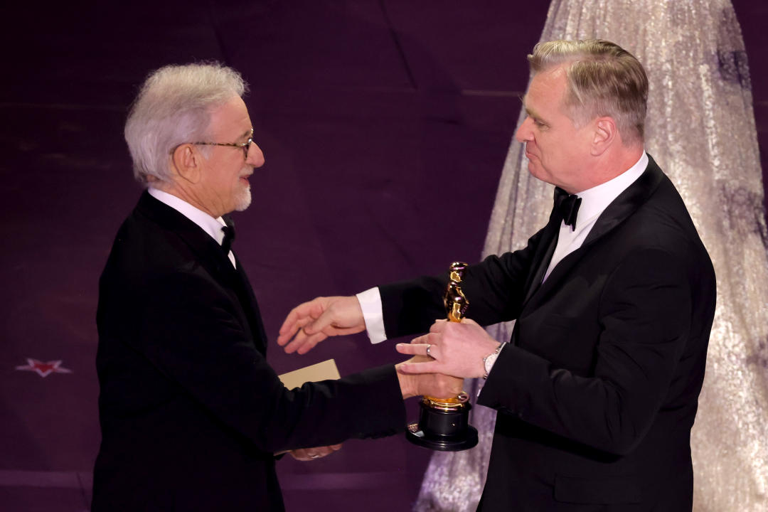 HOLLYWOOD, CALIFORNIA - MARCH 10: (L-R) Steven Spielberg presents the Best Directing award for 