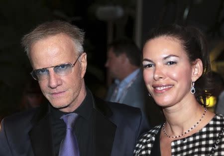 Actor Christopher Lambert arrives with actress Sophie Desmarais for a photocall October 16, 2016 for the television series "Mata Hari" during the annual MIPCOM television programme market in Cannes, France. Picture taken October 16, 2016. REUTERS/Eric Gaillard