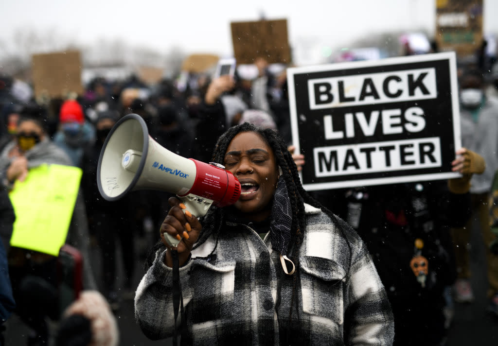 Protesters march outside the Brooklyn Center police headquarters on April 13, 2021 in Brooklyn Center, Minnesota