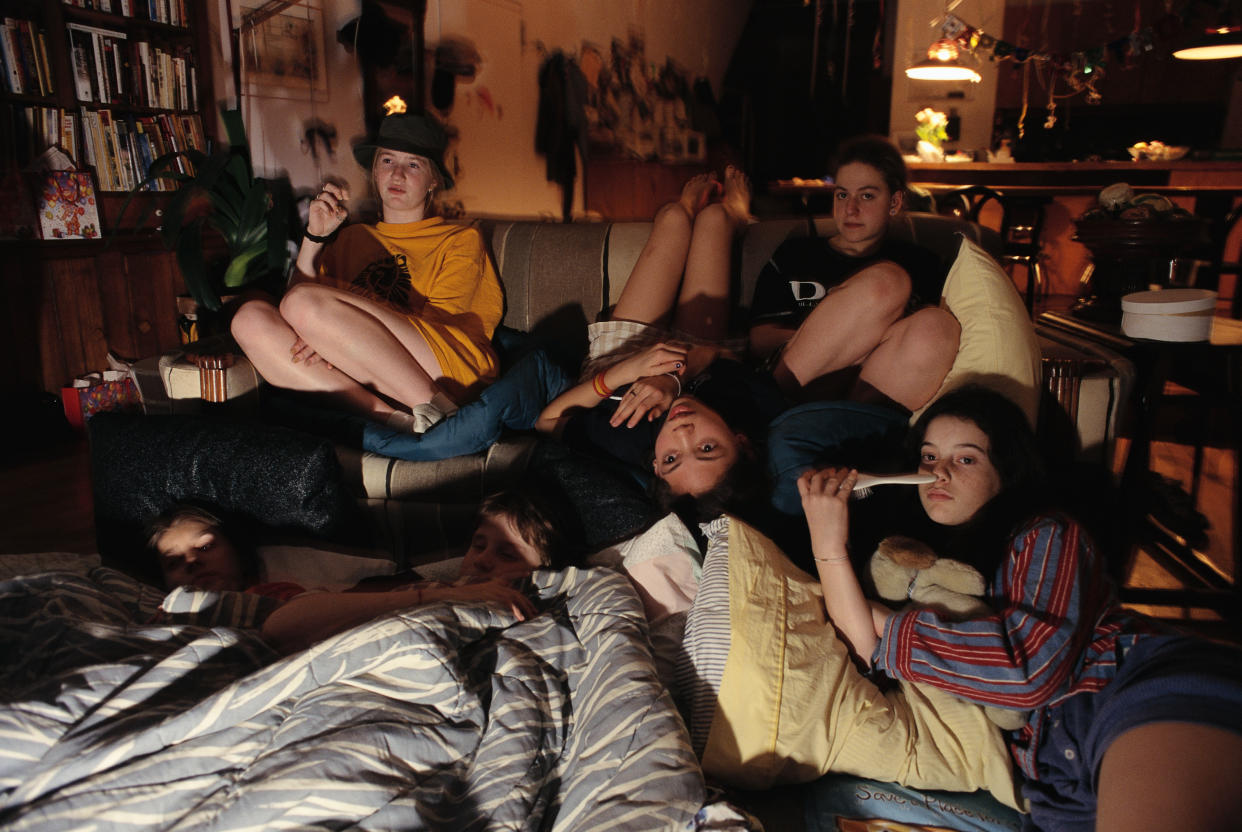 Girlfriends Watching Television During Slumber Party (Photo by mark peterson/Corbis via Getty Images)