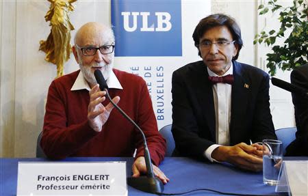 Belgian physicist Francois Englert holds a joint news conference with Prime Minister Elio Di Rupo (R) at the University of Brussels October 8, 2013. REUTERS/Francois Lenoir