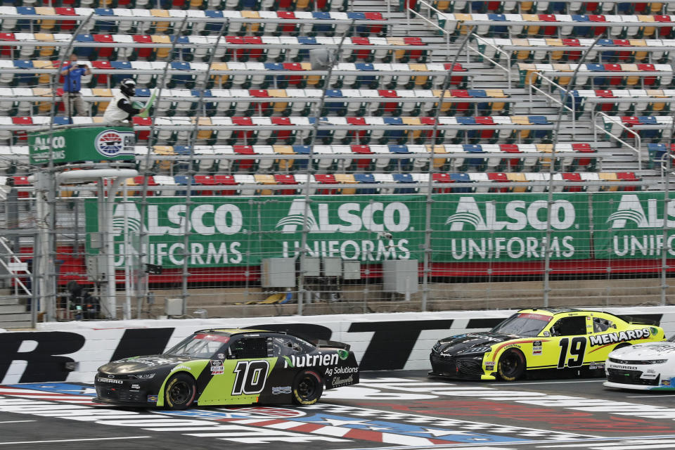 Ross Chastain (10) leads Brandon Jones (19) as they pass under the green flag to start a NASCAR Xfinity Series auto race at Charlotte Motor Speedway Monday, May 25, 2020, in Concord, N.C. (AP Photo/Gerry Broome)