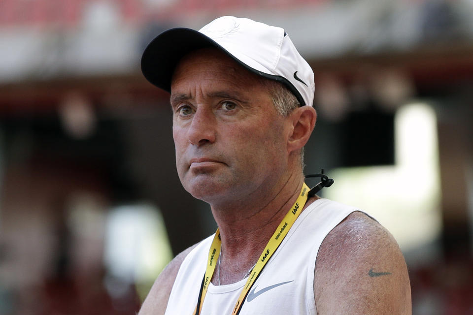 FILE - In this Aug. 21, 2015, file photo, Alberto Salazar watches a training session for the World Athletic Championships at the Bird's Nest stadium in Beijing. Though frequently scrutinized the way any market leader is, Nike’s stranglehold on track and field has been tested over the past few years — if not in a pure dollar-for-dollar sense, then certainly in the way it is perceived by its most fervent followers. A sordid doping case involving Nike’s most high-profile coach, Alberto Salazar, continues to play out this summer at the Court of Arbitration for Sport. (AP Photo/Kin Cheung, File)