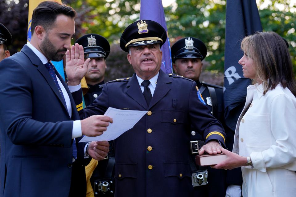 Robert M. Guidetti takes the Paramus Police Chief Oath of Office between mayor, Christopher DiPiazza and Francine Guidetti.  Tuesday, June 13, 2023 