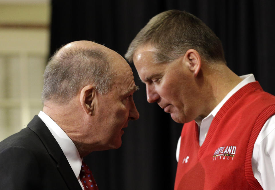 Big Ten Commissioner James Delany, left, speaks with Maryland football coach Randy Edsall after a news conference that was held to announce Maryland's decision to move to the Big Ten in College Park, Md., Monday, Nov. 19, 2012. Maryland is joining the Big Ten, leaving the Atlantic Coast Conference in a shocker of a move in the world of conference realignment that was driven by the school's budget woes. (AP Photo/Patrick Semansky)