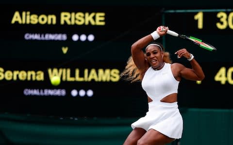 US player Serena Williams returns against US player Alison Riske during their women's singles quarter-final match on day eight of the 2019 Wimbledon Championships at The All England Lawn Tennis Club in Wimbledon, southwest London, on July 9, 2019 - Credit: AFP