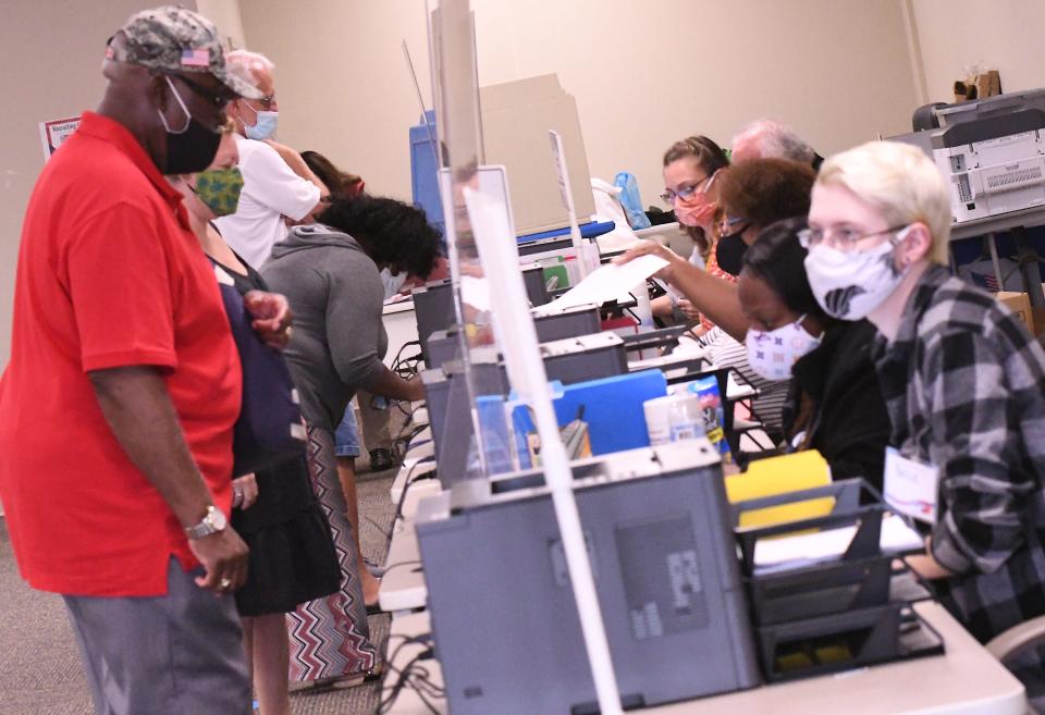 People wait in line at the New Hanover County Government Center to cast their vote as thousands of voters came out Thursday, Oct. 15, 2020, for early voting. STARNEWS FILE PHOTO