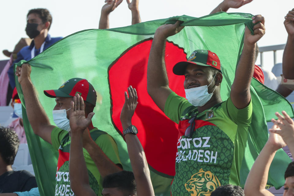 Bangladesh supporters react during the Cricket Twenty20 World Cup match between Bangladesh and Papua New Guinea in Muscat, Oman, Thursday, Oct. 21, 2021. (AP Photo/Kamran Jebreili)