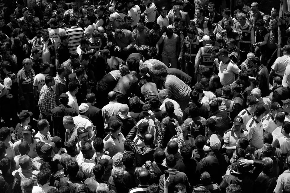 People gathered as security forces collect bodies after deadly twin car bombings that  killed 53 and injured 146 in Reyhanli, a Turkish town on the Syrian border, on 11 May 2013 (Emin Ozmen/Magnum Photos)