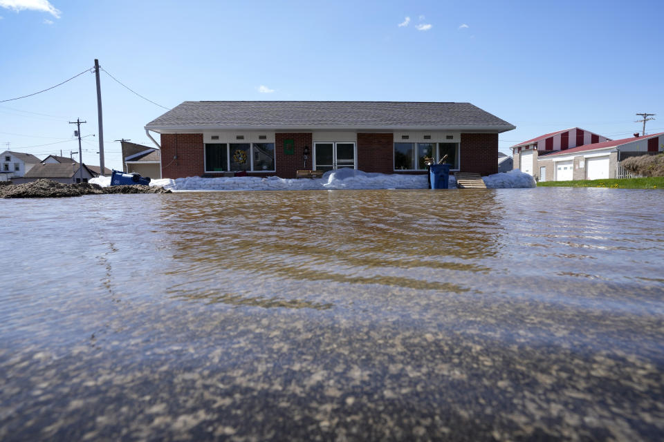 A business sits in floodwaters from the nearby Mississippi River, Monday, May 1, 2023, in Buffalo, Iowa. (AP Photo/Charlie Neibergall)
