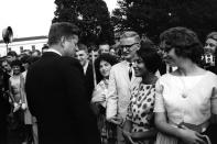 <p>President John F. Kennedy greets Peace Corps volunteers on the South Lawn of the White House in Washington, Aug. 9, 1962. (Photo: Rowland Scherman/Peace Corps/John F. Kennedy Presidential Library and Museum) </p>